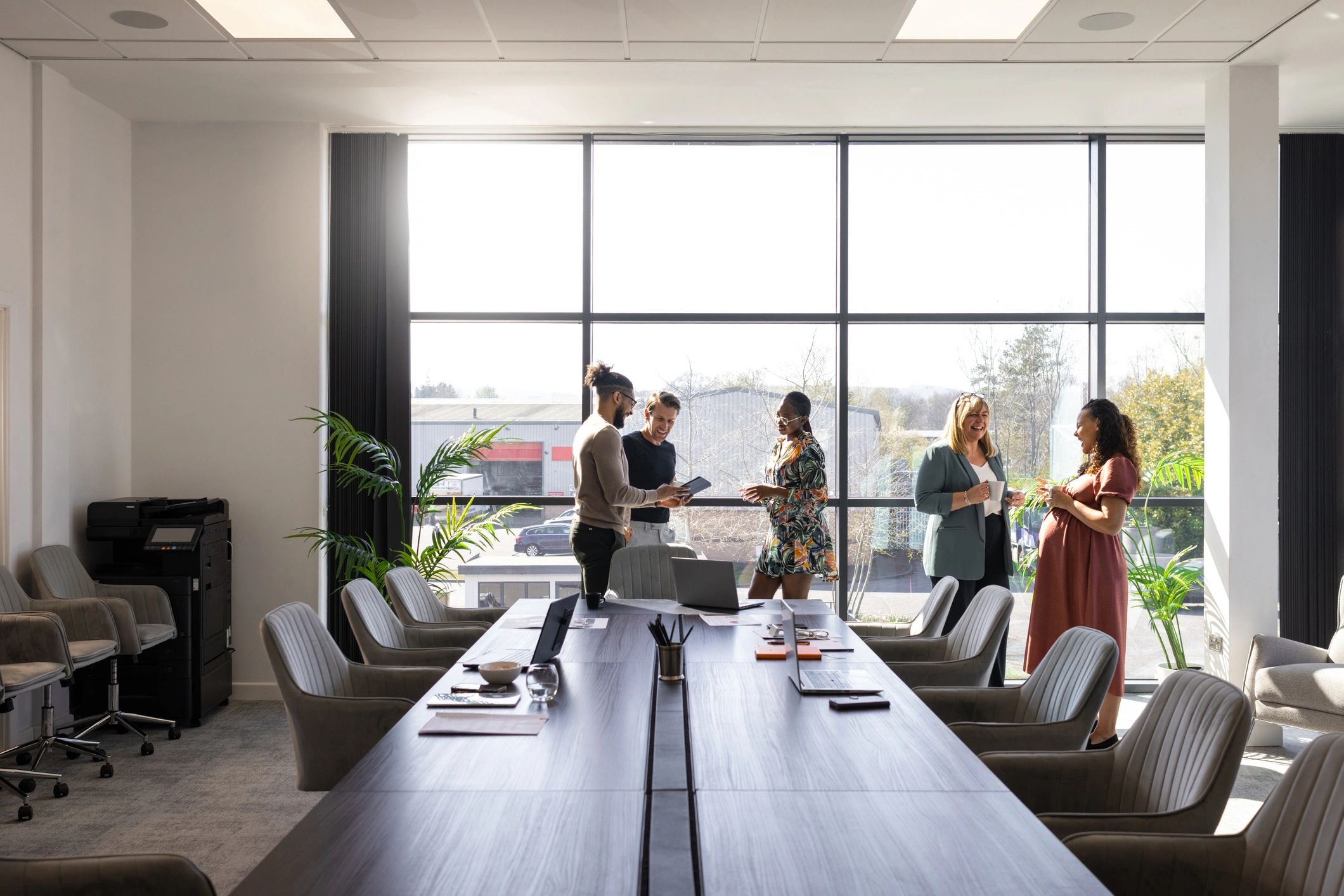 Business professionals meeting in a modern financial services office